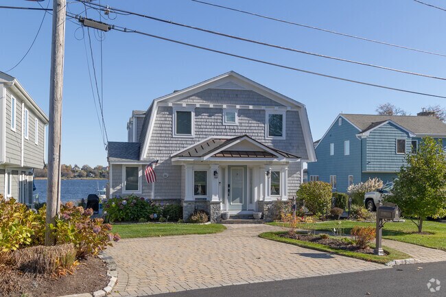 A waterfront home in the Northeast Bristol - Kickemuit neighborhood has modern details.