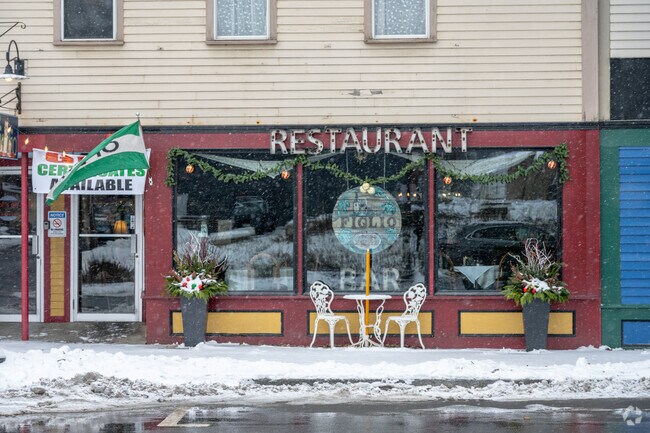 A restaurant decorated with snow along a street in Depot Village in Palmer.