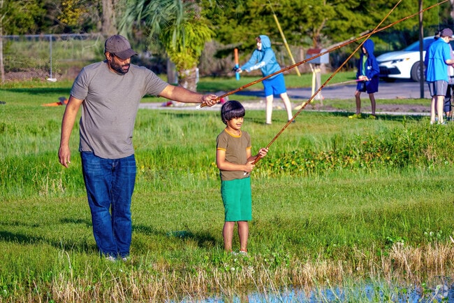 A young boy enjoys fishing with his dad just minutes away from Sugarfoot.