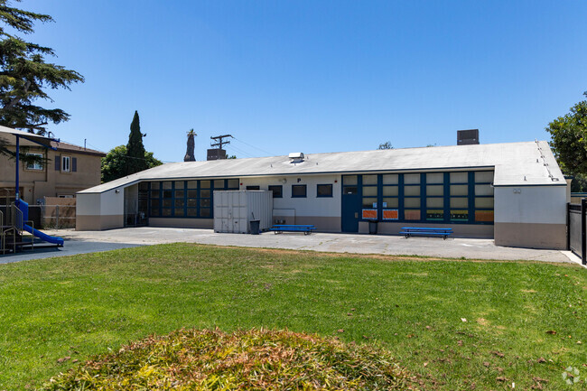 The open field in the school yard is perfect for sports and physical education classes.