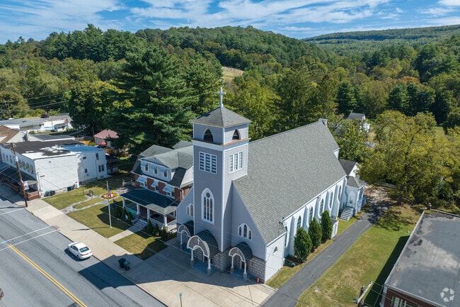Join the community at Holy Cross Church, where the people of New Philadelphia come together to worship on the Sabbath.