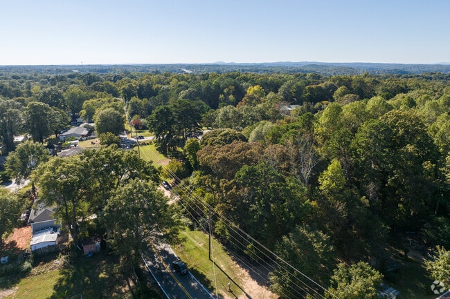 Browns Bridge features shaded streets with lush greenery.
