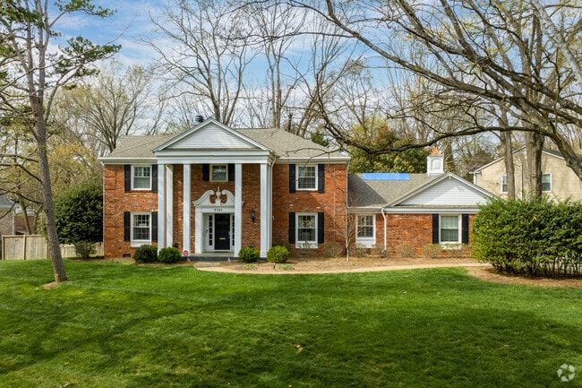 Colonial-style homes can be seen throughout the Quail Hollow neighborhood.