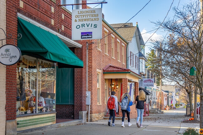Ligonier Township residents stroll past the local shops in town.