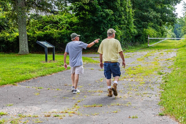 Residents head out for an afternoon stroll on the pathways of the D&R Canal State Park.