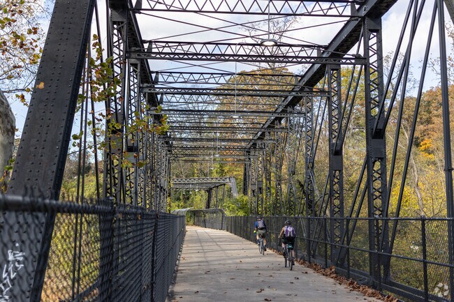 Bikers crossing the Arizona Avenue bridge on the Capitol Crescent Trail in nearby Palisades.