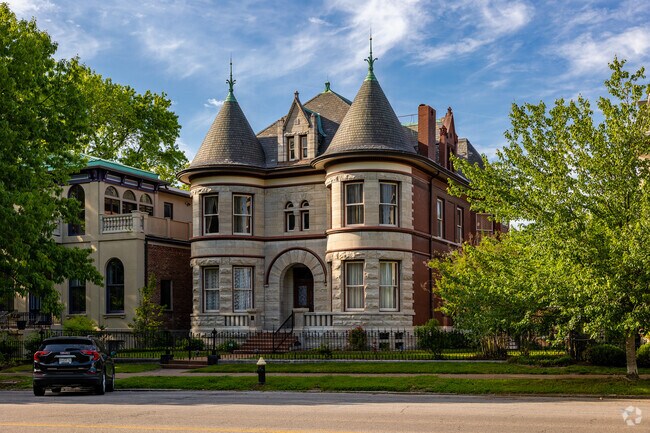 A massive brick and stone 4 story home greets visitors and residents in Lafayette Square.