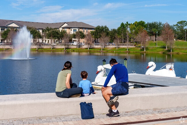 In Oviedo, a young family feeds ducks and turtles at Center Lake Park.