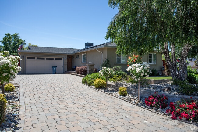 Many of the single family homes in Vine Hill have lush flowers and shrubs.