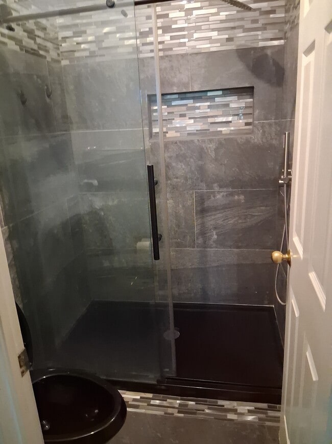 Walk in shower in the master bedroom