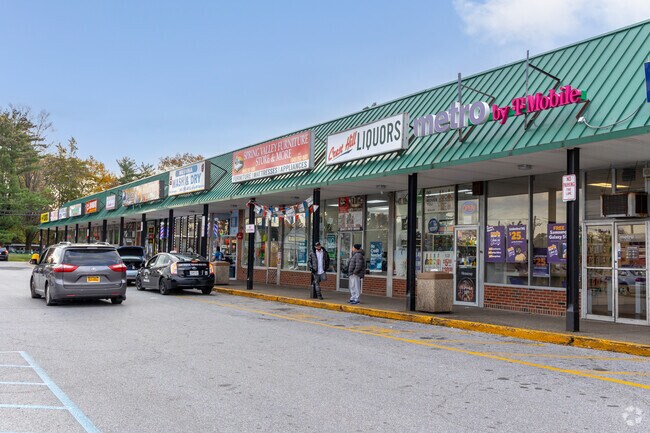 Spring Valley strip mall offers frequent access to groceries, pharmacy, and essentials.