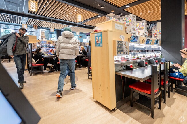 Plates glide by at Kura Revolving Sushi Bar, a fun lunch spot in Woodridge.