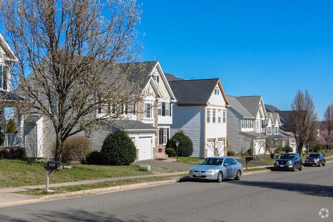 Homes have garages and street parking in Bloom Crossing, VA.