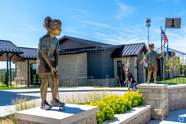 This statue of two kids putting is a proud fixture of the Kickingbird Golf Club near Huntwick.