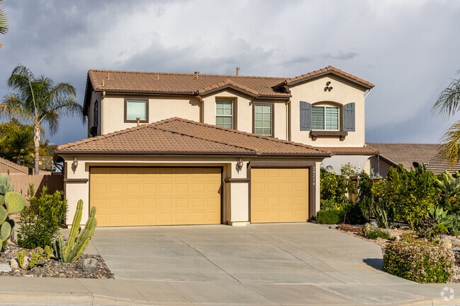​In Lake Elsinore's Lake View District, Spanish-style residences showcase classic stucco exteriors, red-tiled roofs, and arched doorways, reflecting the area's rich architectural heritage. ​