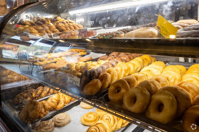 A counter loaded with delicious baked goods at Sunrise Bakery in downtown Fortville.