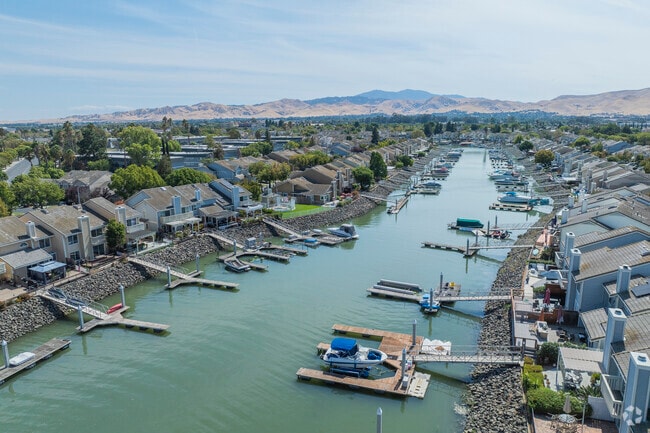 Downtown Pittsburg's homes extend out onto the waterways of the Bay.