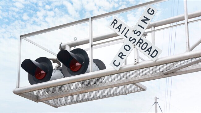 Railroad tracks to the East of Lake Point bring freight trains past houses regularly.