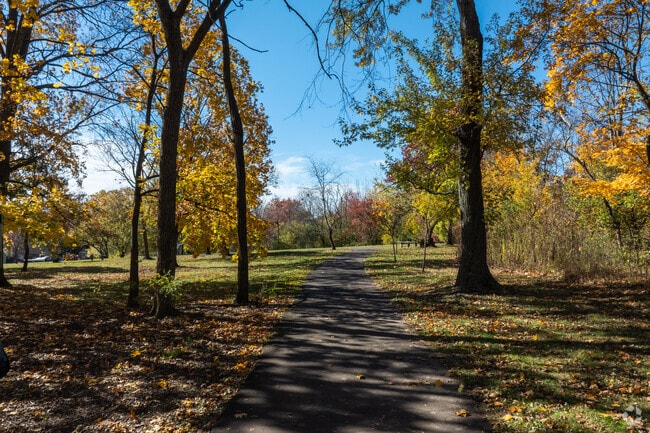 Part of the walking path has shade from the trees at Holly's Hill Park.