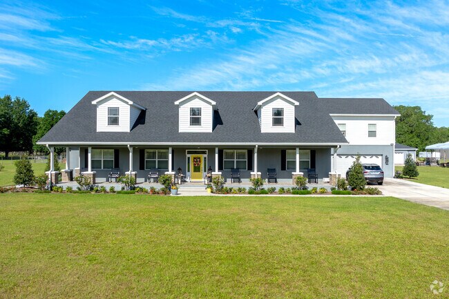 Large front porches with rocking chairs are a popular style in the Hamptons.