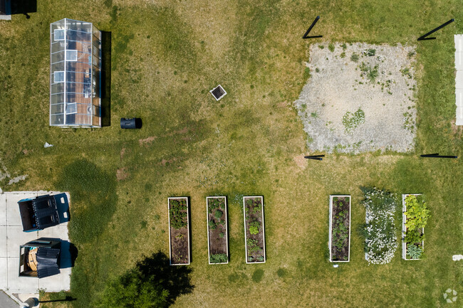A green house and garden boxes at Wahlquist Junior High School.