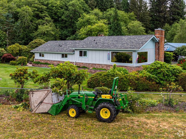 A tractor sits outside a gorgeous ranch-style home in the Aberdeen Gardens neighborhood.