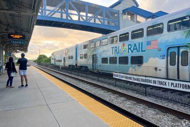 People waiting on the platform at the Boca Raton Tri-Rail Station.