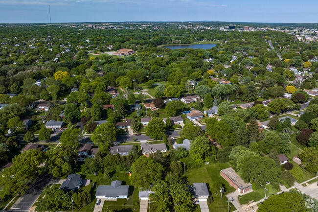 An aerial view of the Meadows neighborhood looking west, with Tiedman Pond in the distance.