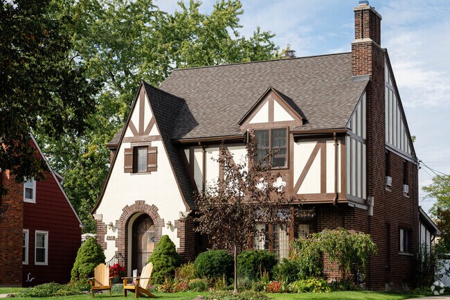 This Tudor style home in Paramount has great landscaping.