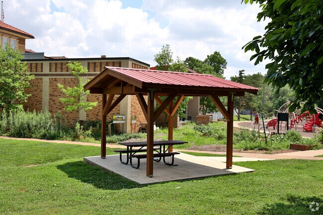 Covered seating has a spot for a picnic with shade at Flynn Park in University City.