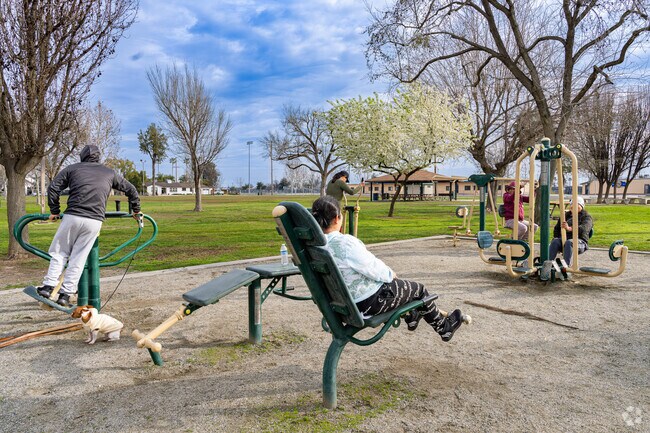 East Delano residents enjoy the free workout equipment at Cecil Park.