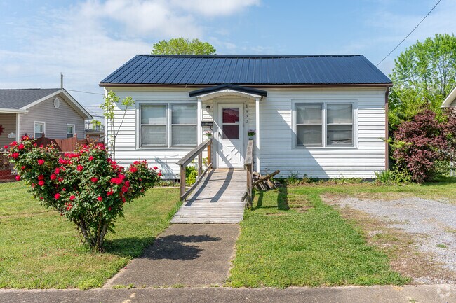 A cottage home with simple, but tasteful landscaping sits on Redwood Drive in Borden Village.