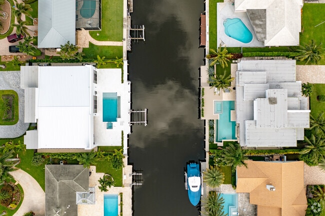 Bird's Eye view of upscale homes with pools in the Tropic Isle neighborhood in Delray Beach, FL.