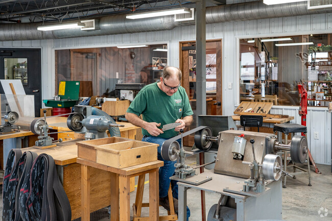 Visitors to the Warther Cutlery Store in Dover, Ohio can watch craftsmen sharpen and repair knives.