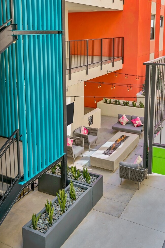 Courtyard lounge with fireplace and smart TV