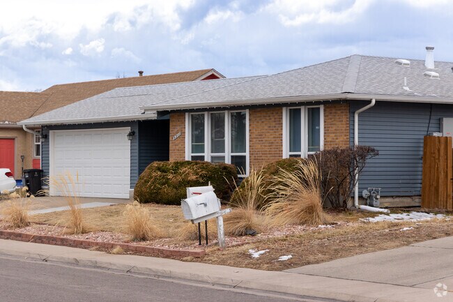This Montbello ranch style home boasts amazing landscaping and a two car garage.