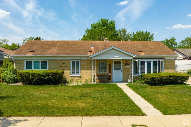 Ranch-style houses can be found in Merrionette Park East with both yard and garage space.