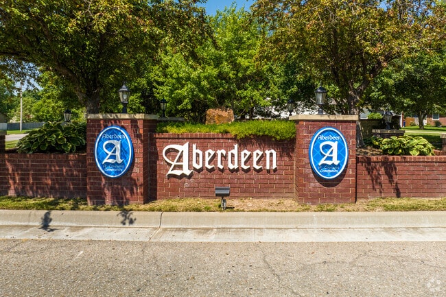 There are several different red brick signs for Aberdeen throughout the neighborhood.