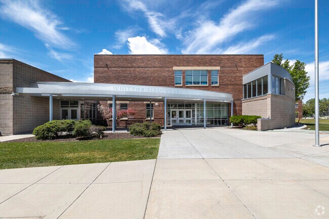 Whittier Elementary School has a covered area at the entrance in Ballpark.