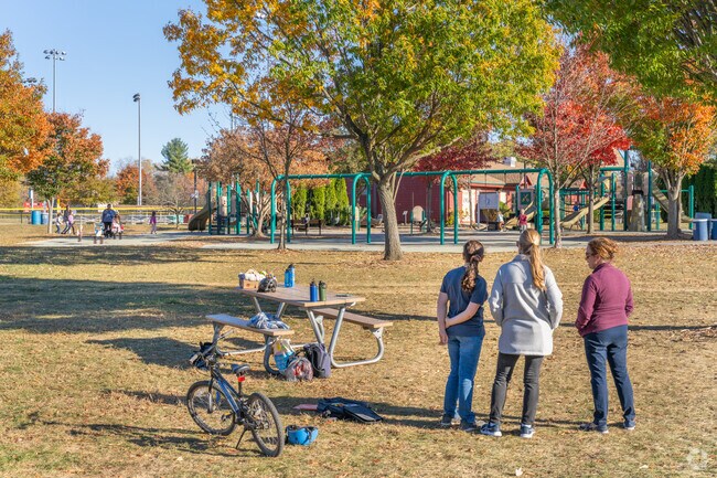 Families enjoy their time making memories at the exciting playground at Heuser Park.