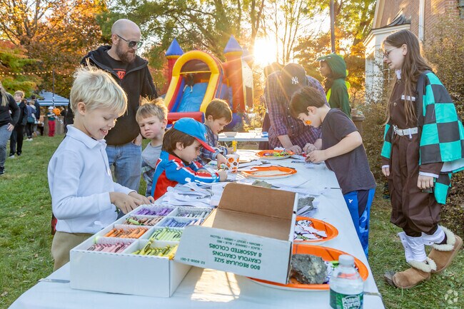 Kids enjoy festive coloring activities at Pumpkin Glow’s Halloween station near Philipstown.