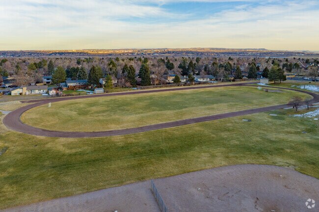 Ken Caryl Middle School features an open field and track field for students.