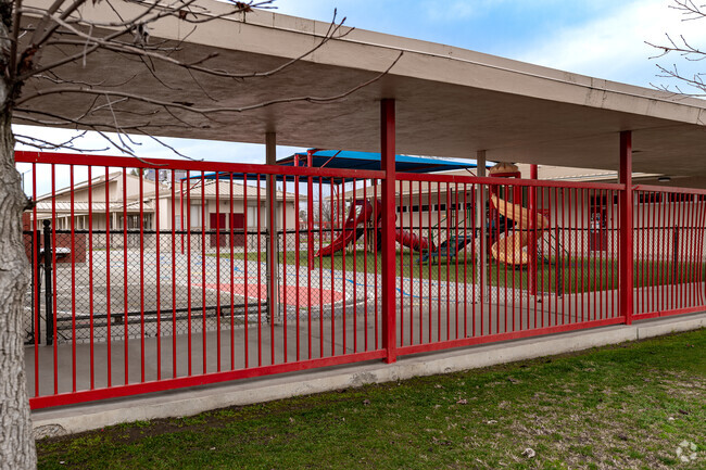 The kindergartner play set is located on the West end of the school grounds.