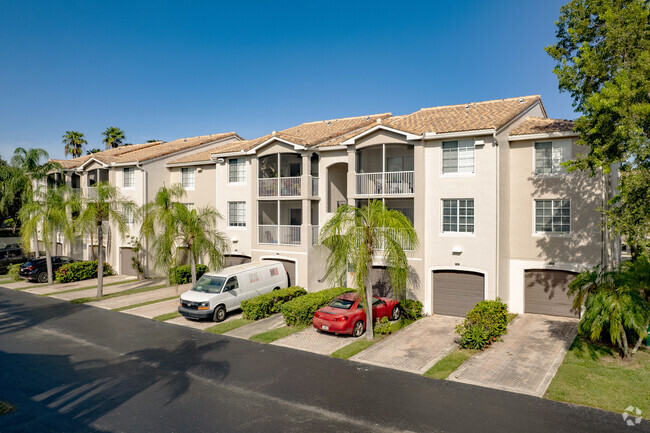 Upscale apartments in Savannah, FL each feature their own balconies and one-car garages.