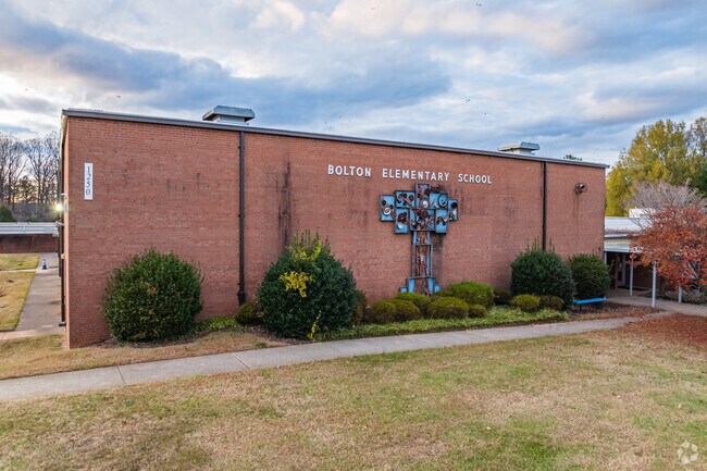 Bolton Elementary School proudly showcases an eclectic sculpture on its front facade.