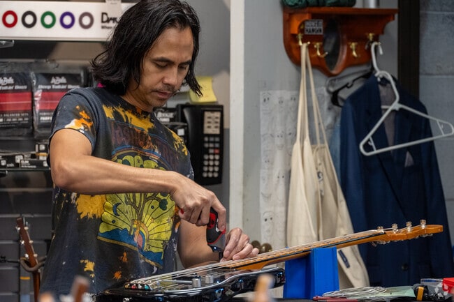 Grayson's Tune Town sells various instruments and offers repairs.