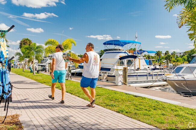 Waterway Estates residents enjoy a nice walk on the water walk at Sunset Village Harbor.