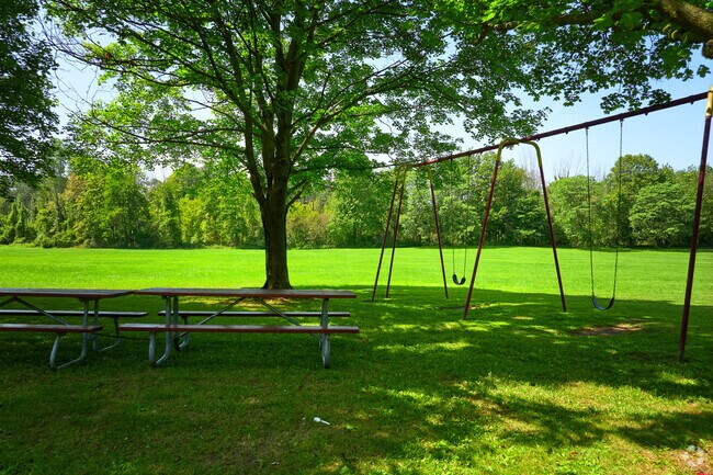 Make use of shaded picnic benches in the playground at Northampton Park.
