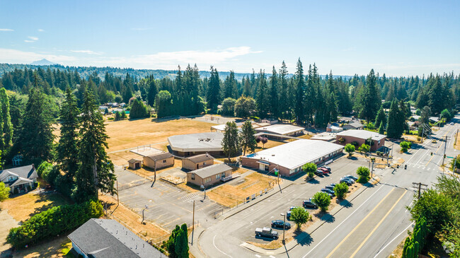 The Shoultes Elementary School campus is surrounded by tall trees in Marysville, WA.
