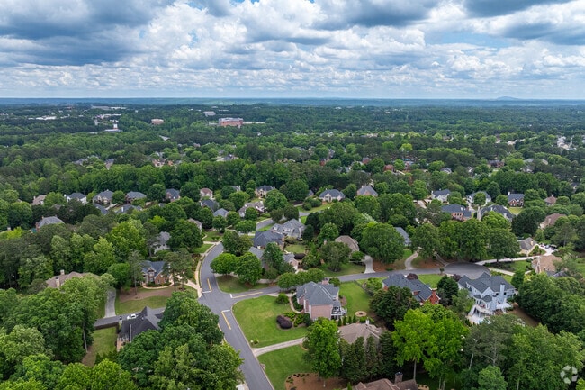 The Seven Oaks community is surrounded by greenery and open space, with homes arranged along winding streets that offer a sense of privacy and calm.